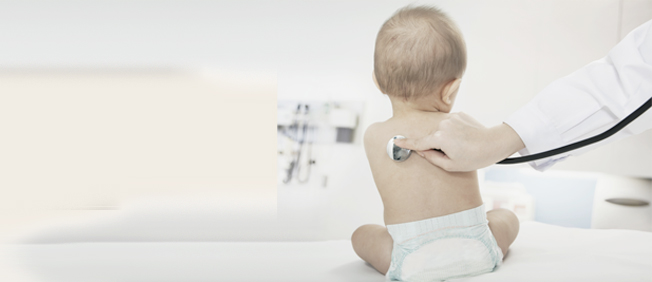 Doctor using stethoscope on baby's back